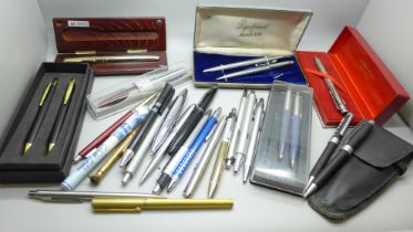 A collection of ballpoint pens, pencils, including one Concorde branded, Parker, etc., approximately