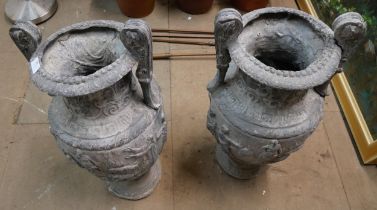 A pair of Victorian Romanesque lead garden urns