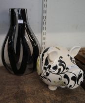 A ceramic pig and an Art glass vase