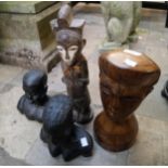 Four assorted carved African figures