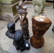 Four assorted carved African figures