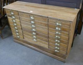 An oak index drawer filing cabinet
