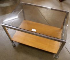 A Howard Miller chrome, teak and glass topped coffee table