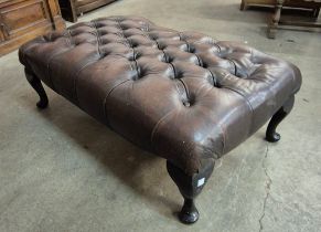 A cheatnut brown leather Chesterfield footstool