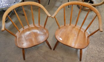 A pair of Ercol Bonde 338 model elm and beech cowhorn chairs