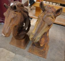 A pair of cast iron horse's head garden ornaments
