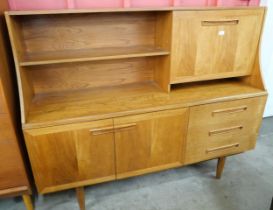 A teak highboard