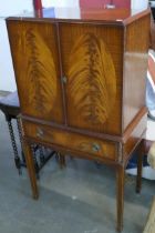A Queen Anne style mahogany cocktail cabinet