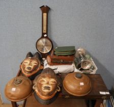 Two carved masks, mahogany photographic plates, a cutlery set, etc.