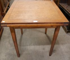 A small oak draw-leaf table