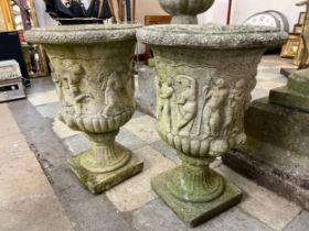 A pair of Victorian style campana shaped concrete garden urns