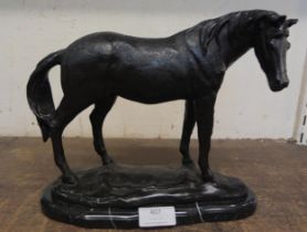 A bronze figure of a horse