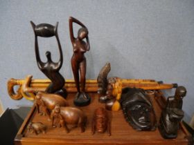 Assorted carved wood figures and walking sticks