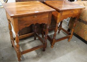 A pair of George III style hardwood single drawer lamp tables