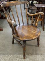 A Victorian beech penny seat kitchen elbow chair