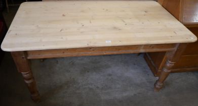 A Victorian style pine kitchen table