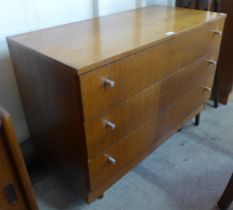 A teak chest of drawers