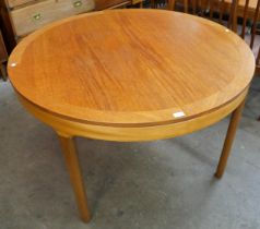 A Nathan circular teak extending dining table