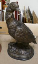 A bronze figure of a bird