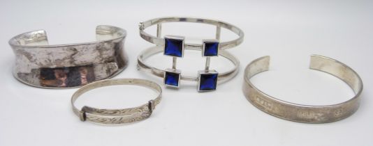Four silver bangles, 115g, (one smaller size)