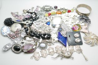 A collection of costume jewellery including a silver bangle, 23g