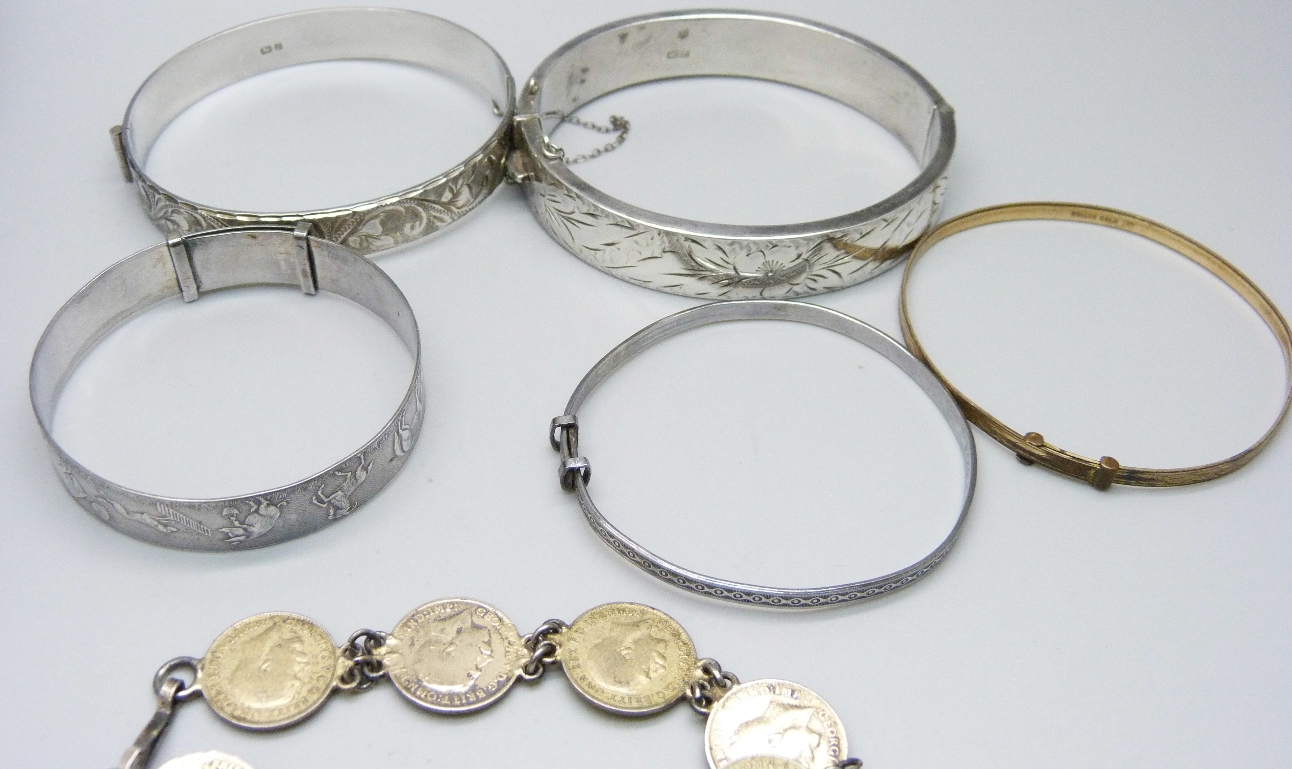 Silver jewellery including four silver bangles and a silver charm bracelet, coins and a sovereign - Image 3 of 6