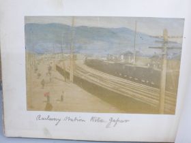 A Japanese lacquered photograph album with Japan photographs including Kobe, Yokohama, Kyoto, Cherry