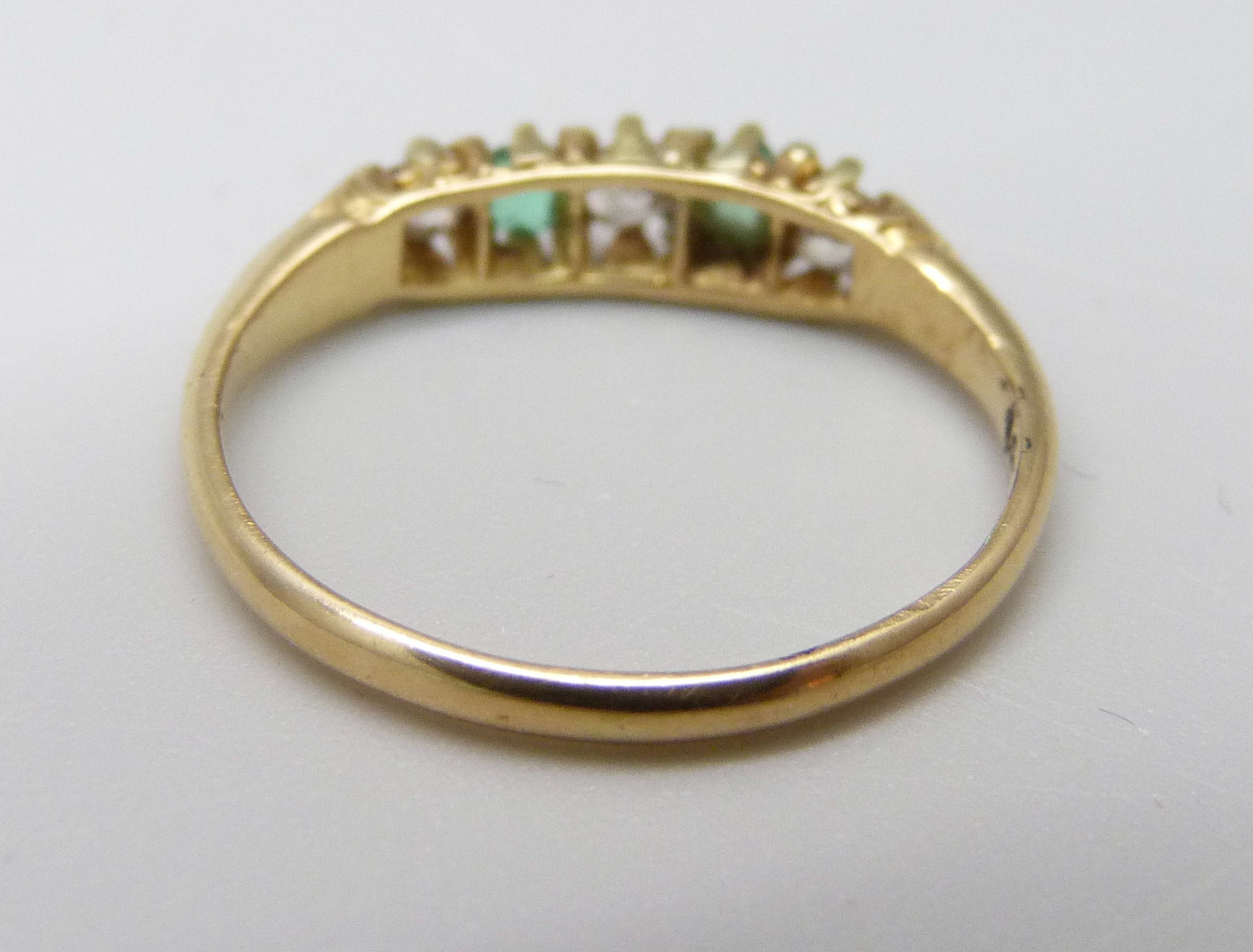 An 18ct gold, emerald and diamond seven stone ring, 2g, J - Image 3 of 3