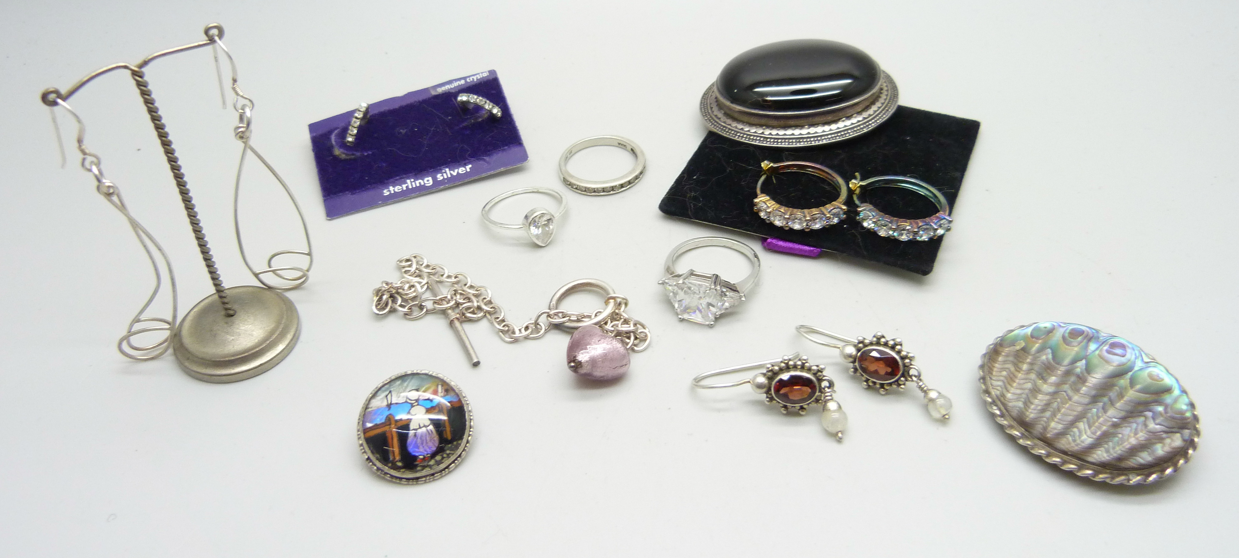 Silver brooches including butterfly wings, earrings, silver rings, etc.