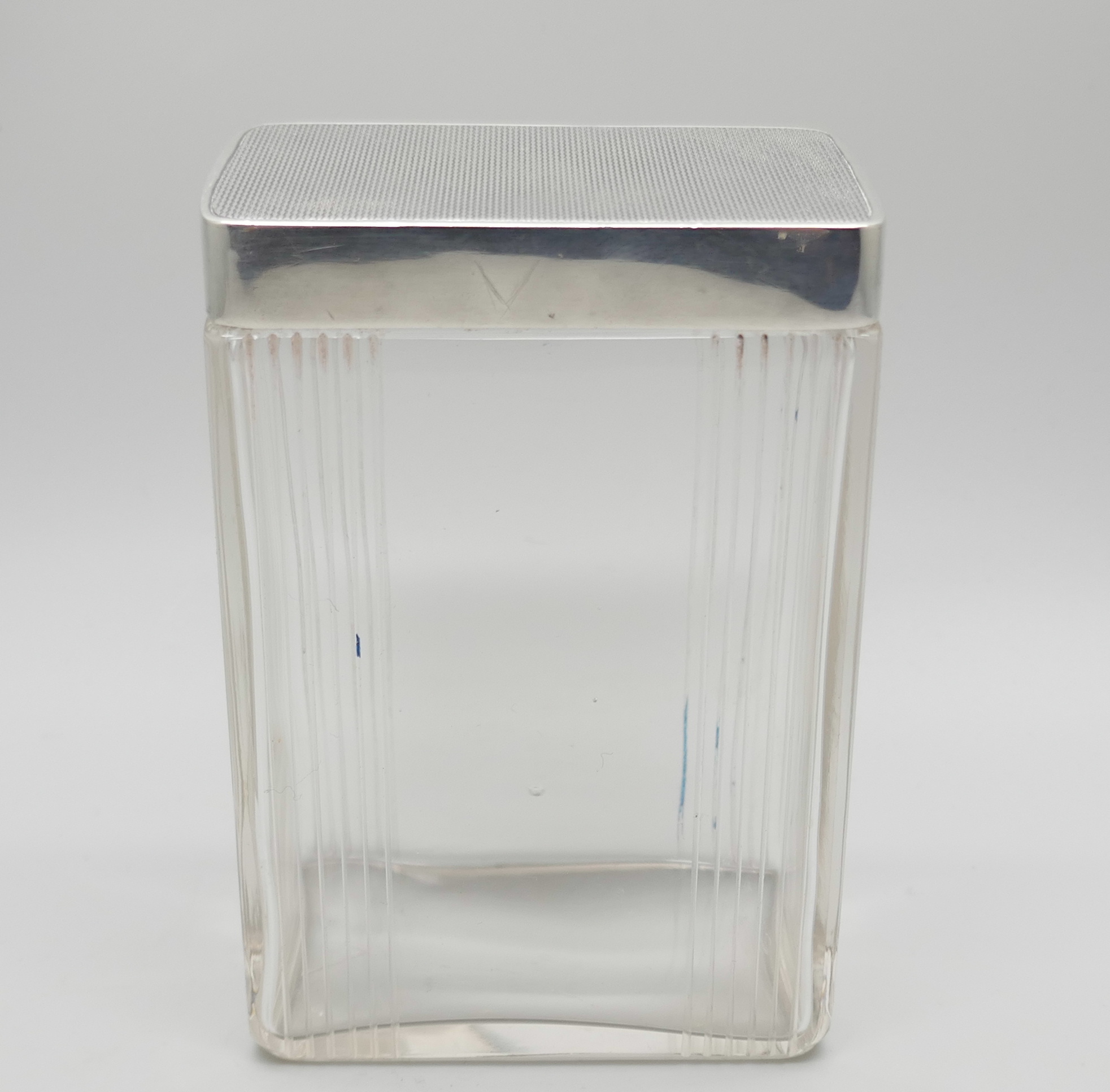 An Art Deco silver topped cut glass jar. Birmingham 1939, height 88mm