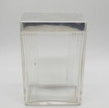 An Art Deco silver topped cut glass jar. Birmingham 1939, height 88mm