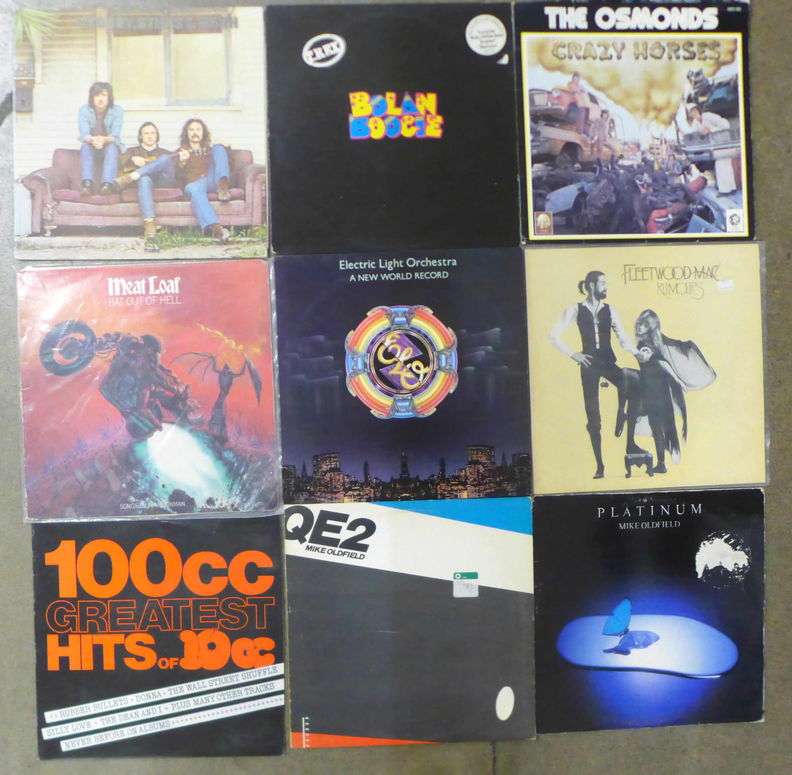 A collection of rock LP records, Queen, Meatloaf, Fleetwood Mac, Heart, Eagles, etc.