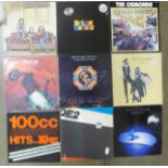 A collection of rock LP records, Queen, Meatloaf, Fleetwood Mac, Heart, Eagles, etc.