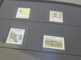 A black case with a collection of mint Faroe Island stamps in blocks