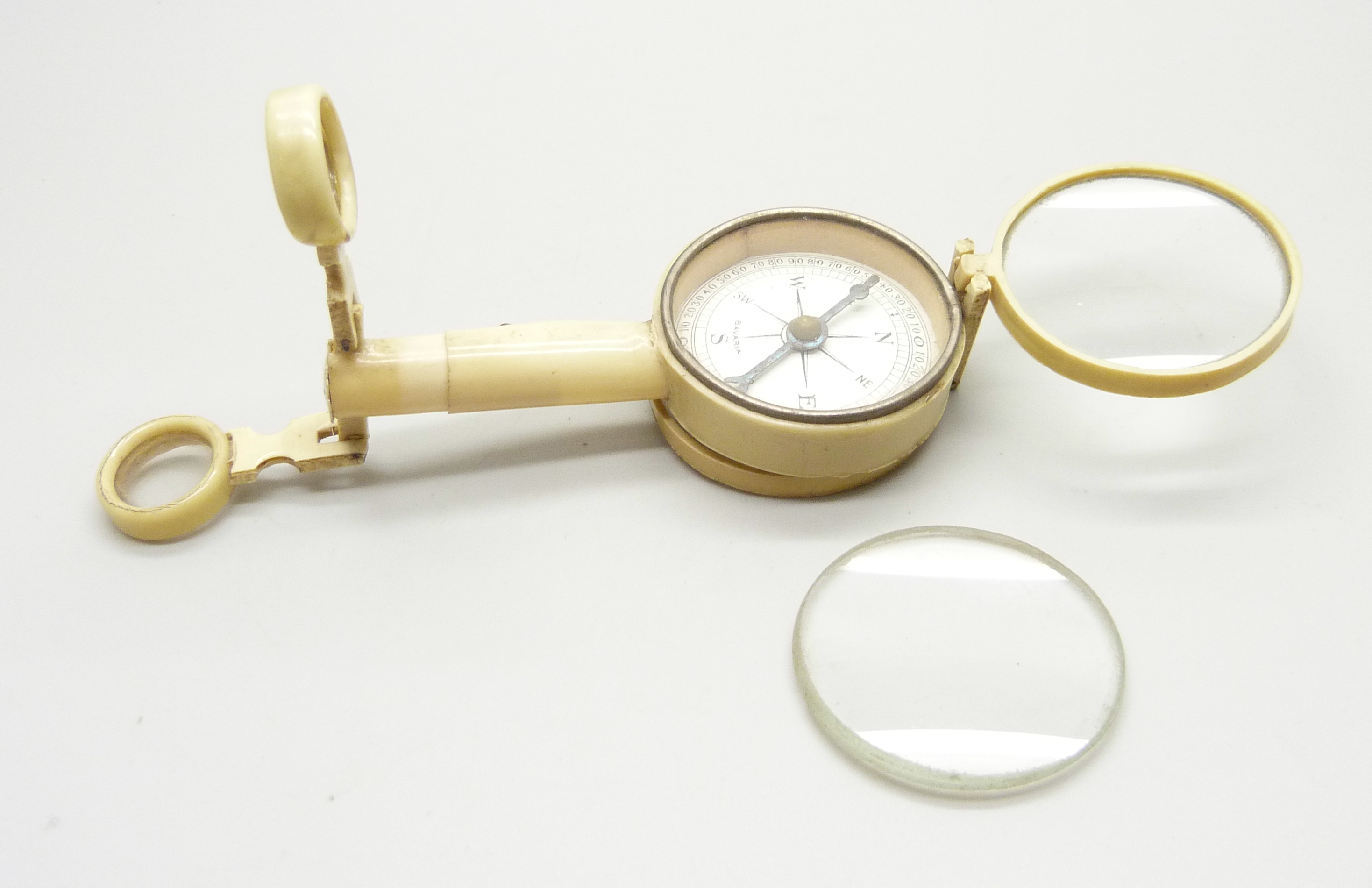 An antique travelling compass, marked Bavaria, a/f, lens frame requires repair