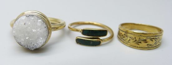 Three silver gilt rings, K, M and P