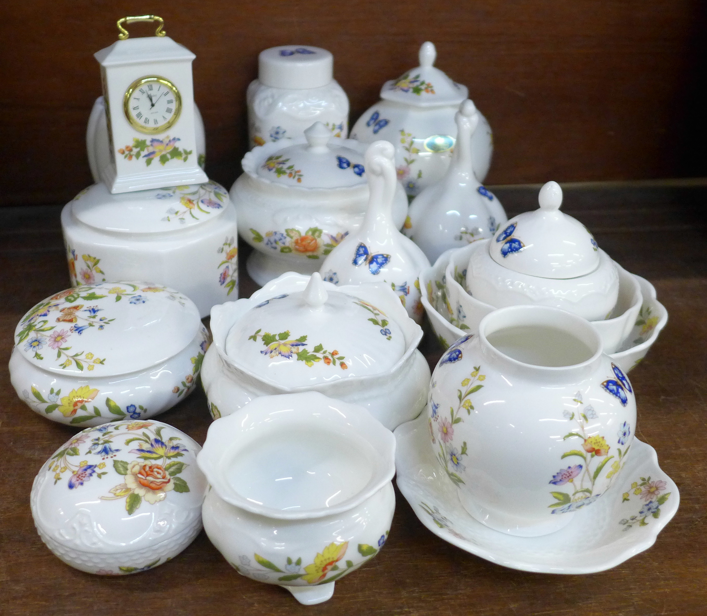 A collection of Aynsley Cottage Garden lidded pots, bells, clock and bowls, seventeen in total