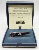 A hallmarked Swedish silver tie-clip, limited edition solid silver 'Sandvik Handsaws', 075, boxed