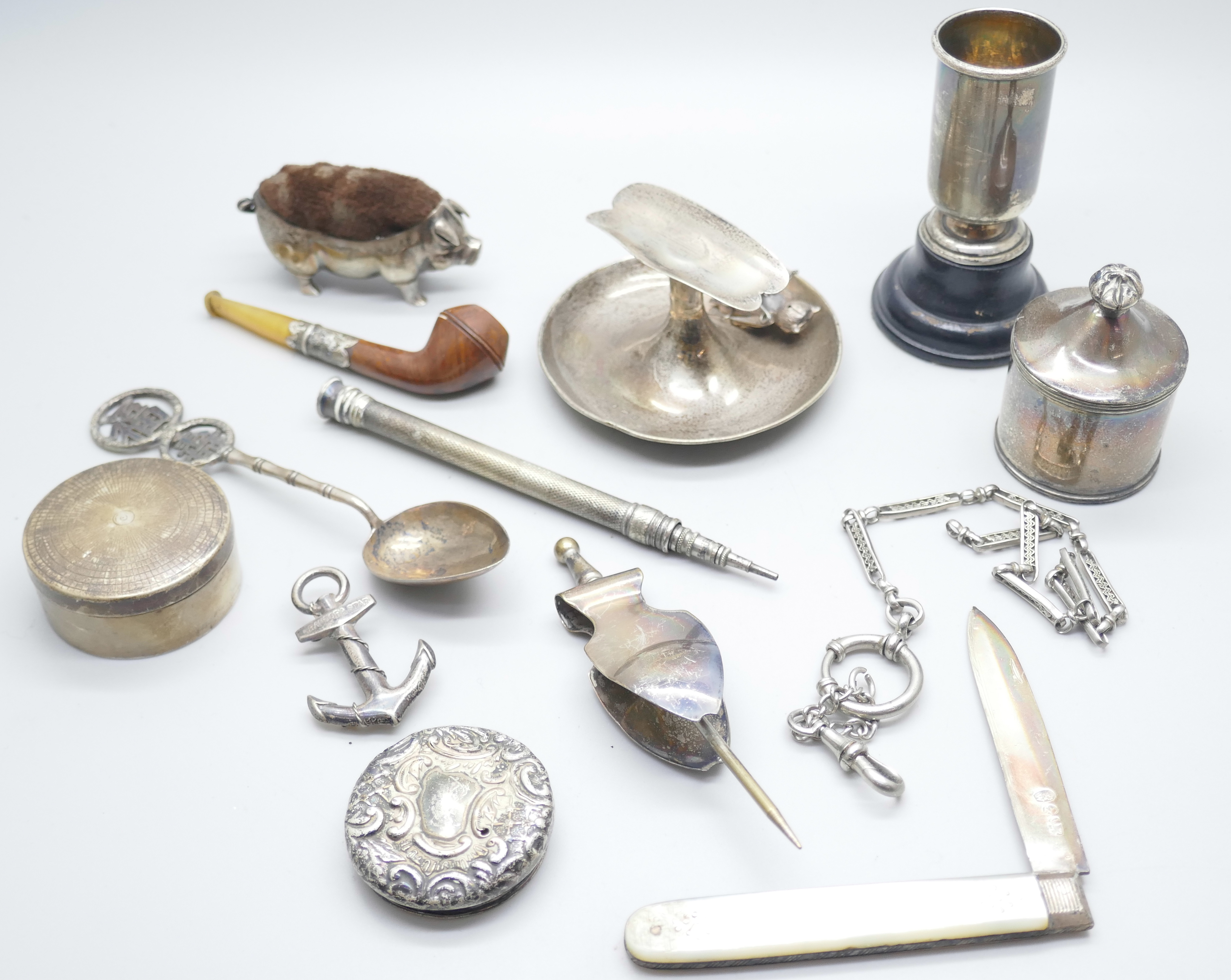 A collection of silver, etc.; including silver pig pin cushion, Birmingham 1905, silver cigar