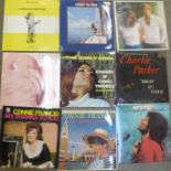 A collection of LP records including Elvis Presley, Lionel Richie, Johnny Cash, etc.