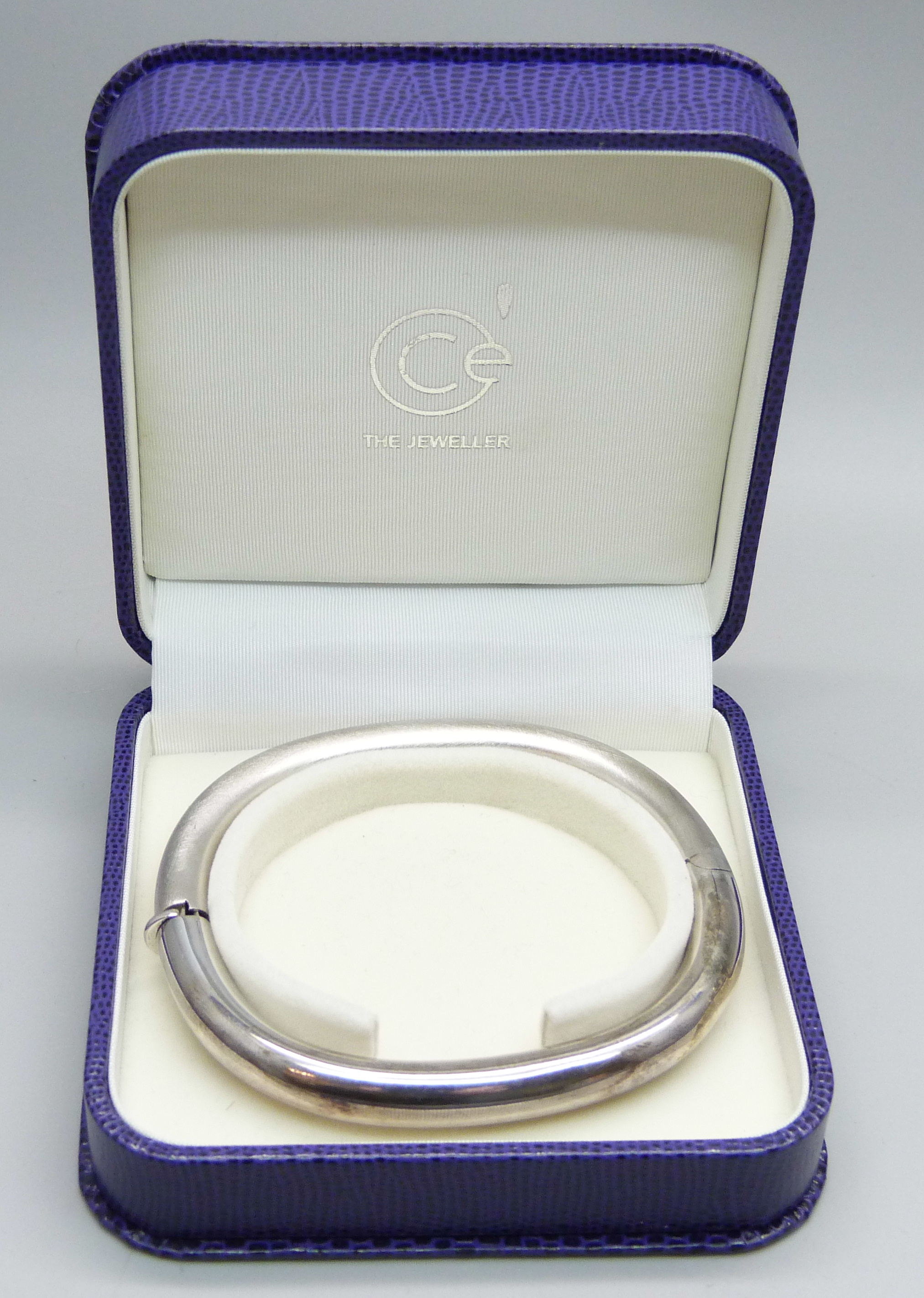 A modernist silver bangle, 25g, in original box