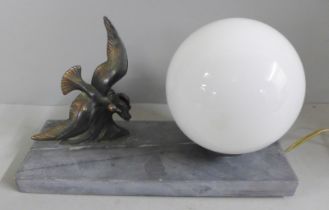 An Art Deco lamp with bird decoration on a marble plinth
