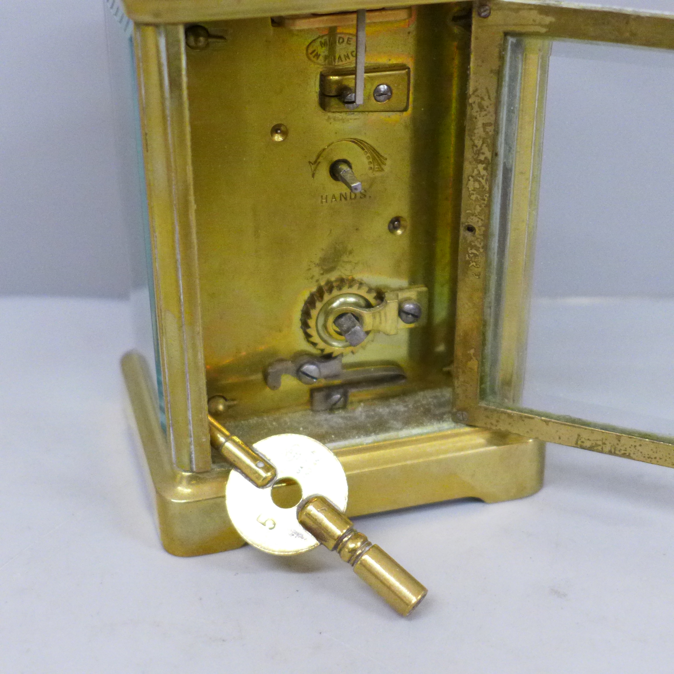 A French brass and four glass sided carriage clock with key - Image 3 of 5