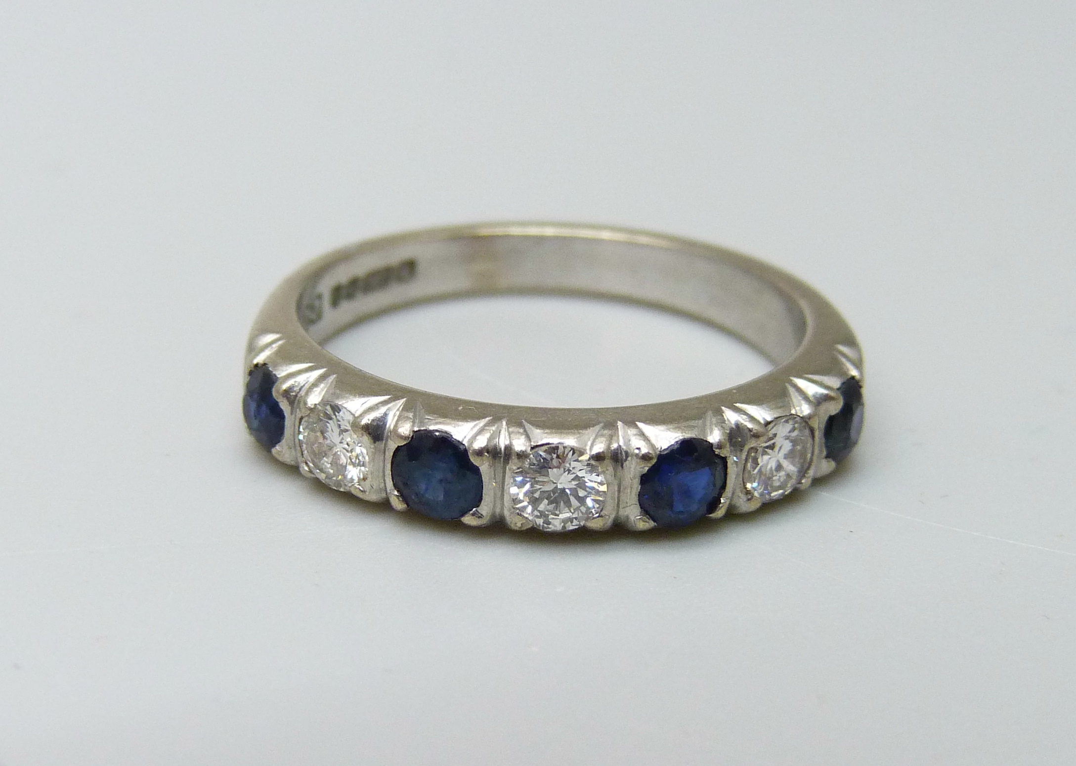 An 18ct white gold, diamond and sapphire ring, Sheffield 1977, 5.1g, Q, over 0.5ct total diamond