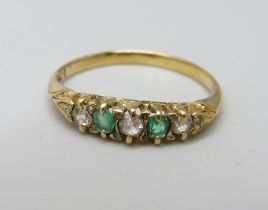 An 18ct gold, emerald and diamond seven stone ring, 2g, J
