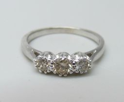 An 18ct white gold and diamond trilogy ring, 0.5ct total diamond weight marked on the shank, 3.2g, O