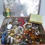 A tin of costume jewellery, etc.