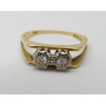 An 18ct gold and two stone diamond ring, 2.2g, J