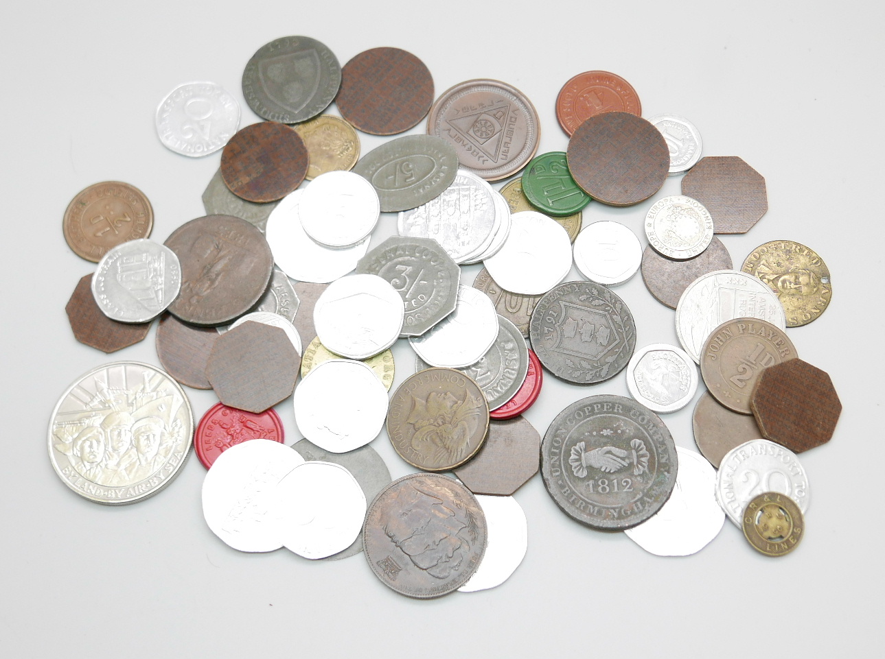 A mixed lot of tokens, transport tokens, etc.