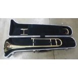 A Blessing USA trombone, cased, dented in some parts